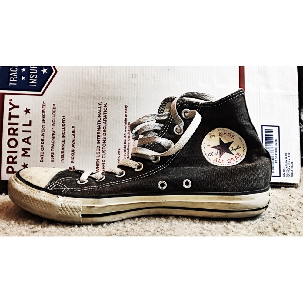 Worn black and white converse